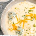Overhead closeup of a bowl of three cheese broccoli soup.