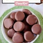 Overhead view of homemade York peppermint patty candy in a white bowl.