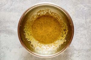 Spinach salad dressing base in a bowl.