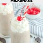 Homemade Chick Fil A cookies and cream milkshake with whipped cream and a maraschino cherry.