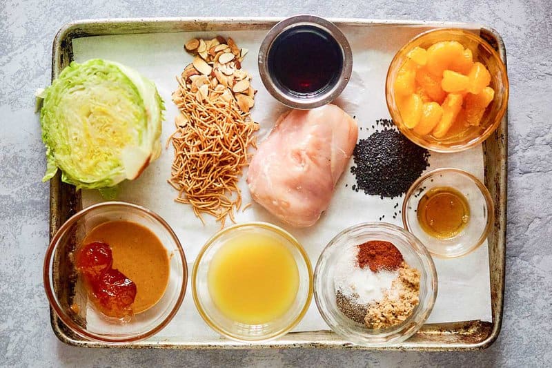 Chinese chicken salad ingredients on a tray.