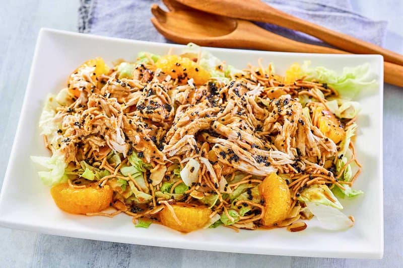 Chinese chicken salad on a white platter.