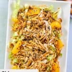 Chinese chicken salad with chow mein noodles on a platter.