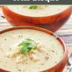 Creamy crab bisque with lump crab meat on top.