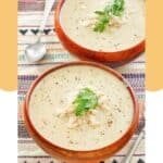 Bowls of crab bisque and spoons.