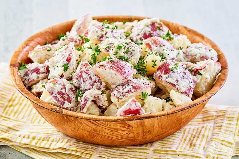 A bowl of dill potato salad.