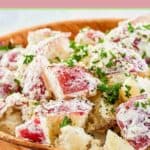 Closeup of dill potato salad with red potatoes.