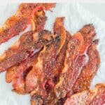 Overhead view of homemade Dunkin snackin bacon on parchment paper.