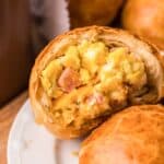 Copycat Dunkin stuffed biscuit bites with ham, egg, and cheese on a plate.