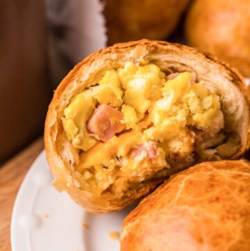 Copycat Dunkin stuffed biscuit bites with ham, egg, and cheese on a plate.