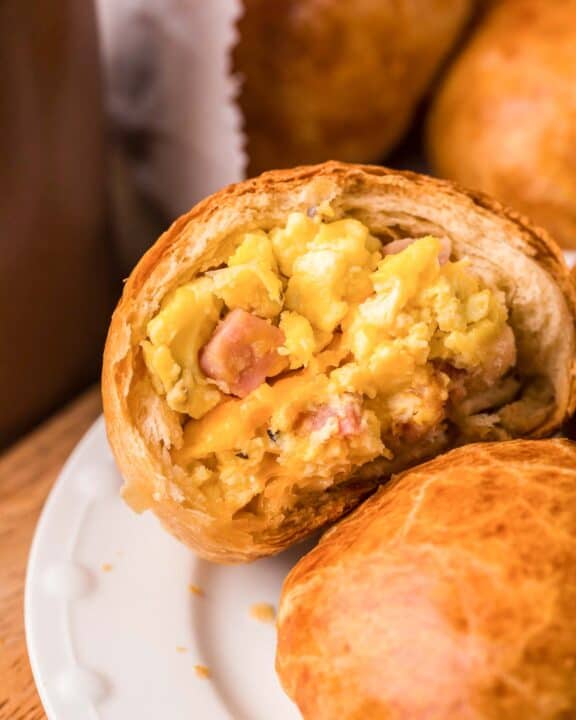 Copycat Dunkin stuffed biscuit bites with ham, egg, and cheese on a plate.