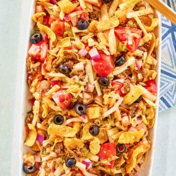 Overhead view of frito taco salad on a platter.