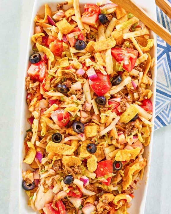 Overhead view of frito taco salad on a platter.
