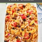 Frito taco salad on a white platter.