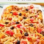 Frito taco salad with catalina salad dressing on a platter.