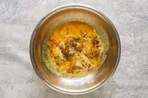 Mac and cheese sauce mixture in a bowl.