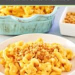 A serving of macaroni and cheese with bread crumb topping on a white plate.
