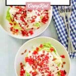Overhead view of wedge salads with maytag buttermilk blue cheese dressing and two forks.