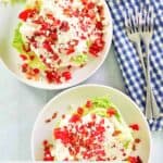 Overhead view of two wedge salads with maytag buttermilk blue cheese dressing.