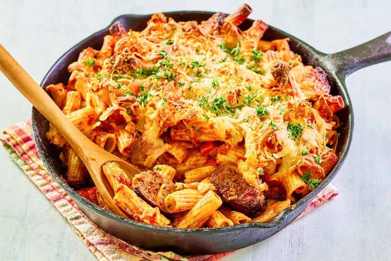 One pot sausage pasta in a cast iron skillet.