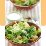 Caesar salad and a bowl of copycat Outback Caesar salad dressing.