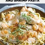 Homemade Outback Queensland chicken and shrimp pasta dish in a wood bowl.