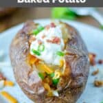 Copycat Outback Steakhouse loaded baked potato on a plate.