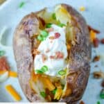 Homemade Outback baked potato on a plate.
