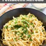 Homemade Pasta House Company fettuccine alfredo in a black bowl.
