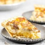 Slice of pineapple cheesecake pie on a plate.