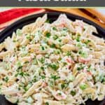 A large bowl of seafood pasta salad.