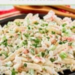 Seafood pasta salad in a large black serving bowl.