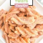 Overhead view of homemade Taco Bell cinnamon twists on a square plate.