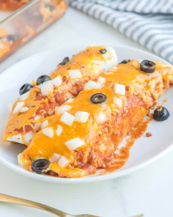 Two copycat Taco Bell enchiritos on a plate.