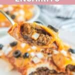 Homemade Taco Bell enchirito on a fork over a plate with enchiritos.
