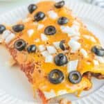 Two homemade Taco Bell enchiritos on a plate.