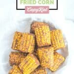 Overhead view of homemade Wingstop cajun fried corn in a bowl lined with white parchment paper.