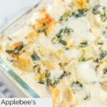 Closeup of homemade Applebee's spinach artichoke dip in a baking dish.