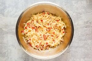 Ham and hash brown casserole mixture in a bowl.