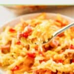 Cheesy ham and hash brown casserole on a white plate and on a fork.
