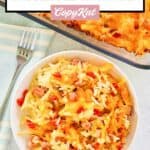 Overhead view of cheesy ham and hash brown casserole in a baking dish and on a plate.
