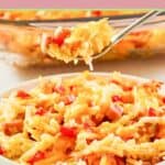 Cheesy ham and hashbrown casserole on a fork over a serving on a plate.