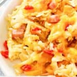 Closeup of cheesy ham and hash brown casserole on a plate.