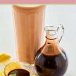 Homemade chocolate syrup in a small bowl and pitcher.