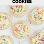 Overhead view of homemade Crumble birthday cake cookies scattered on a marble surface.