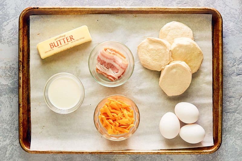 Copycat Dunkin stuffed biscuit bites with bacon on a tray.