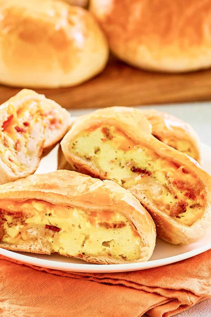 Closeup of copycat Dunkin stuffed biscuit bites with bacon on a plate.