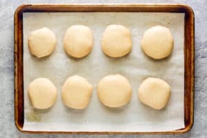 Copycat Dunkin stuffed biscuit bites with bacon before baking.
