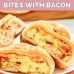 Two homemade Dunkin stuffed biscuit bites with bacon cut in half and on a plate.