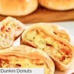Closeup of homemade Dunkin stuffed biscuit bites with bacon on a plate.